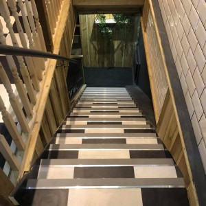 Karndean Opus Vinyl Flooring fitted on stairs in Newton Abbot Restaurant in a black and white checkerboard effect