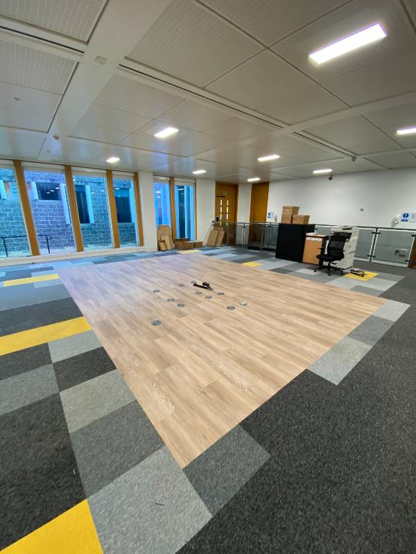 Interface LVT Fitted with carpet tiles to create a seamless finish without threshold